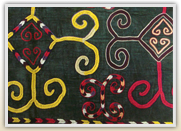 Dark teal embroidered textile